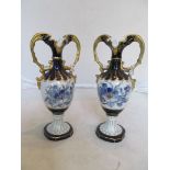 A pair of Royal Dux two handled vases