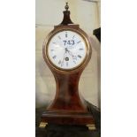 An Edwardian mahogany balloon shaped mantel clock with white enamel dial