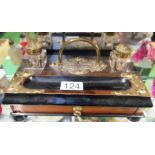 A Victorian inkstand with brass fittings