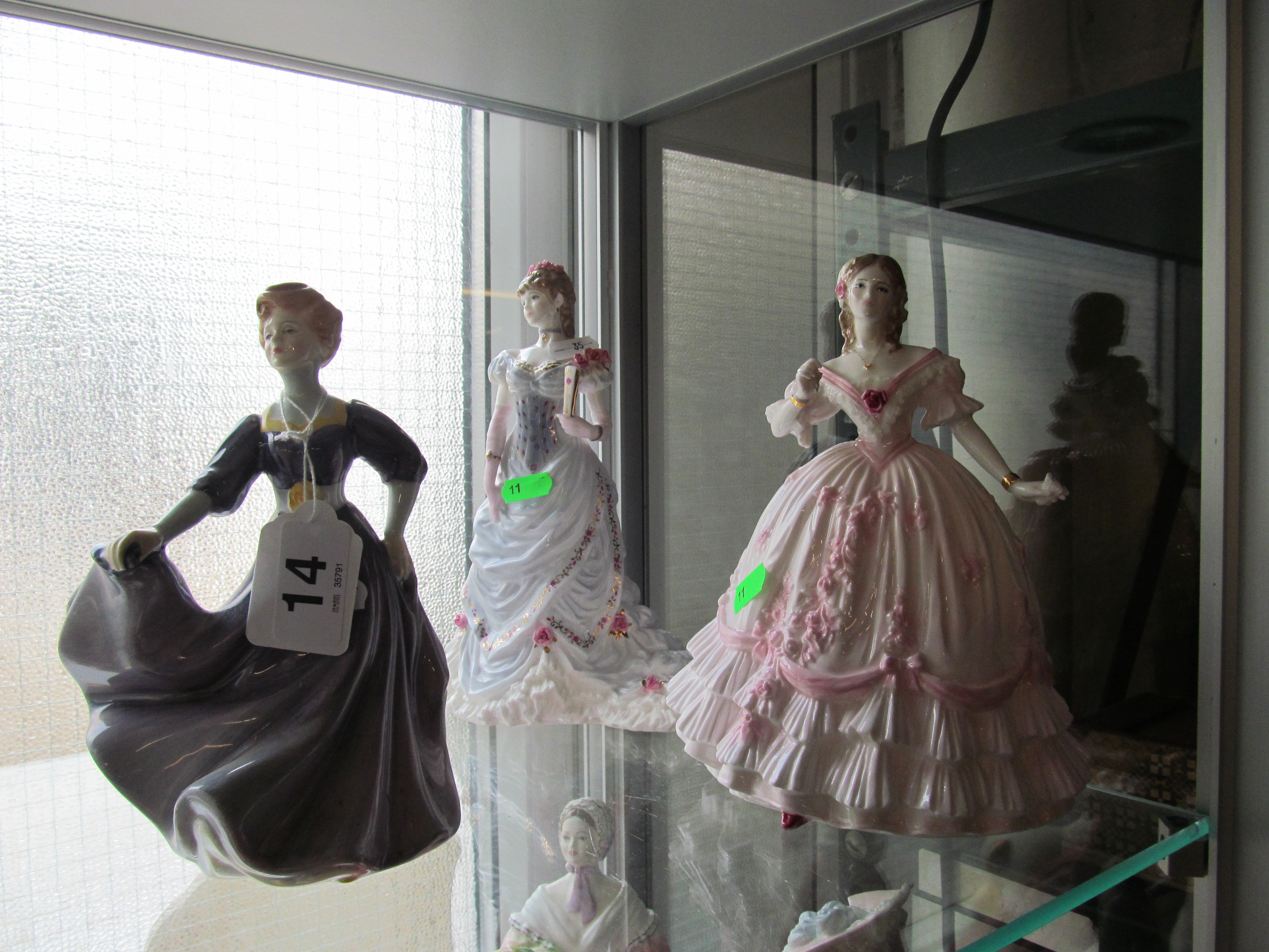 Three Royal Doulton figures,’ Jacqueline', 'The Golden Jubilee Ball' and 'The Masquerade Begins' (