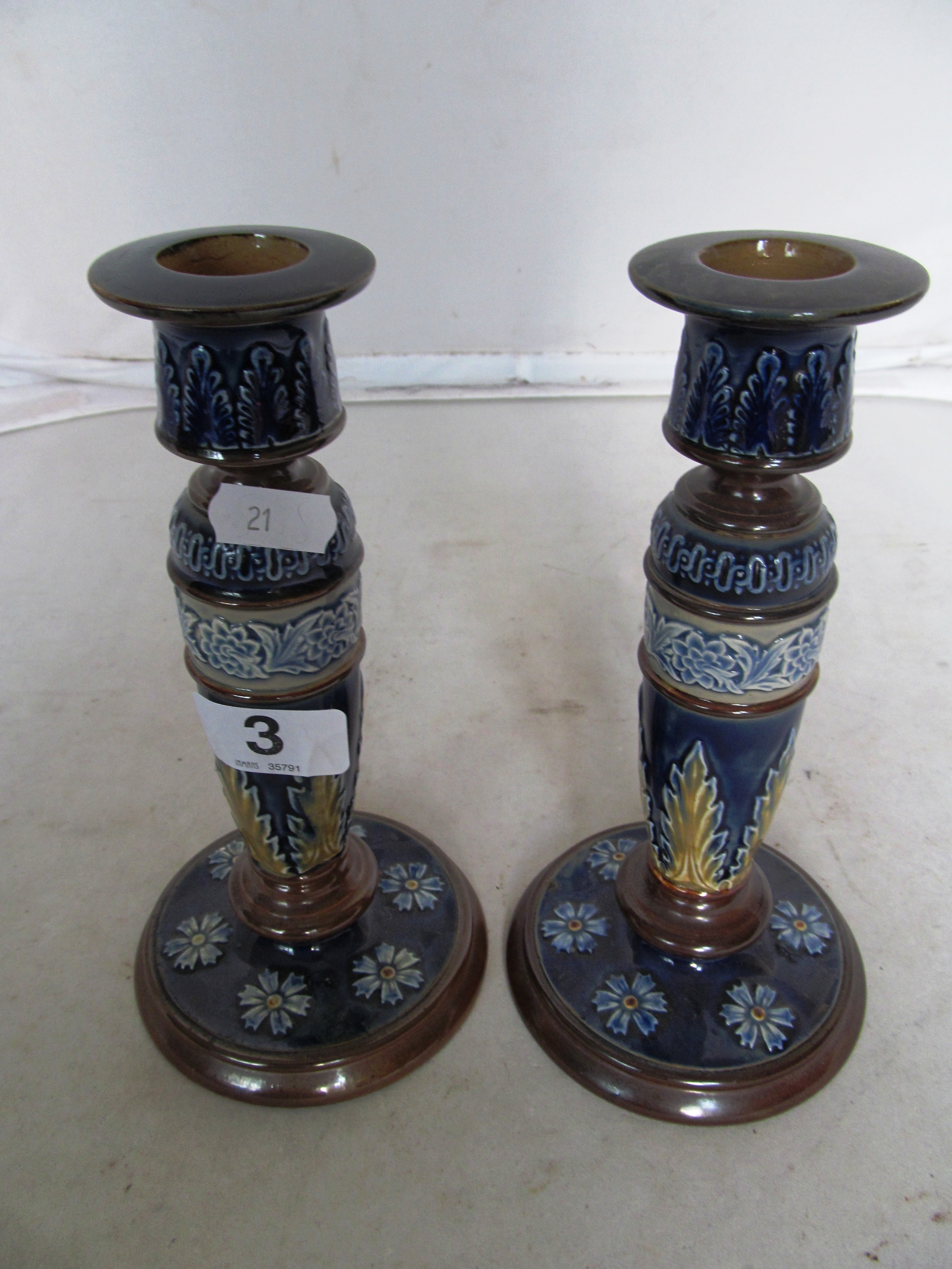 A pair of Doulton Lambeth candlesticks