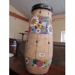 A large floor standing vase with stylized floral decoration