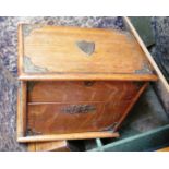 A 19th Century oak cabinet with hinged top and fold down lower front