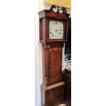 A 19th Century oak longcase clock with swan neck pediment, painted dial with date aperture.