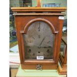 An oak bracket clock, silvered dial and eight day striking and chiming movement