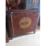 A pair of oriental cabinets two doors with metal locking bar