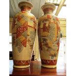 A pair of large Japanese satsuma vases decorated figures