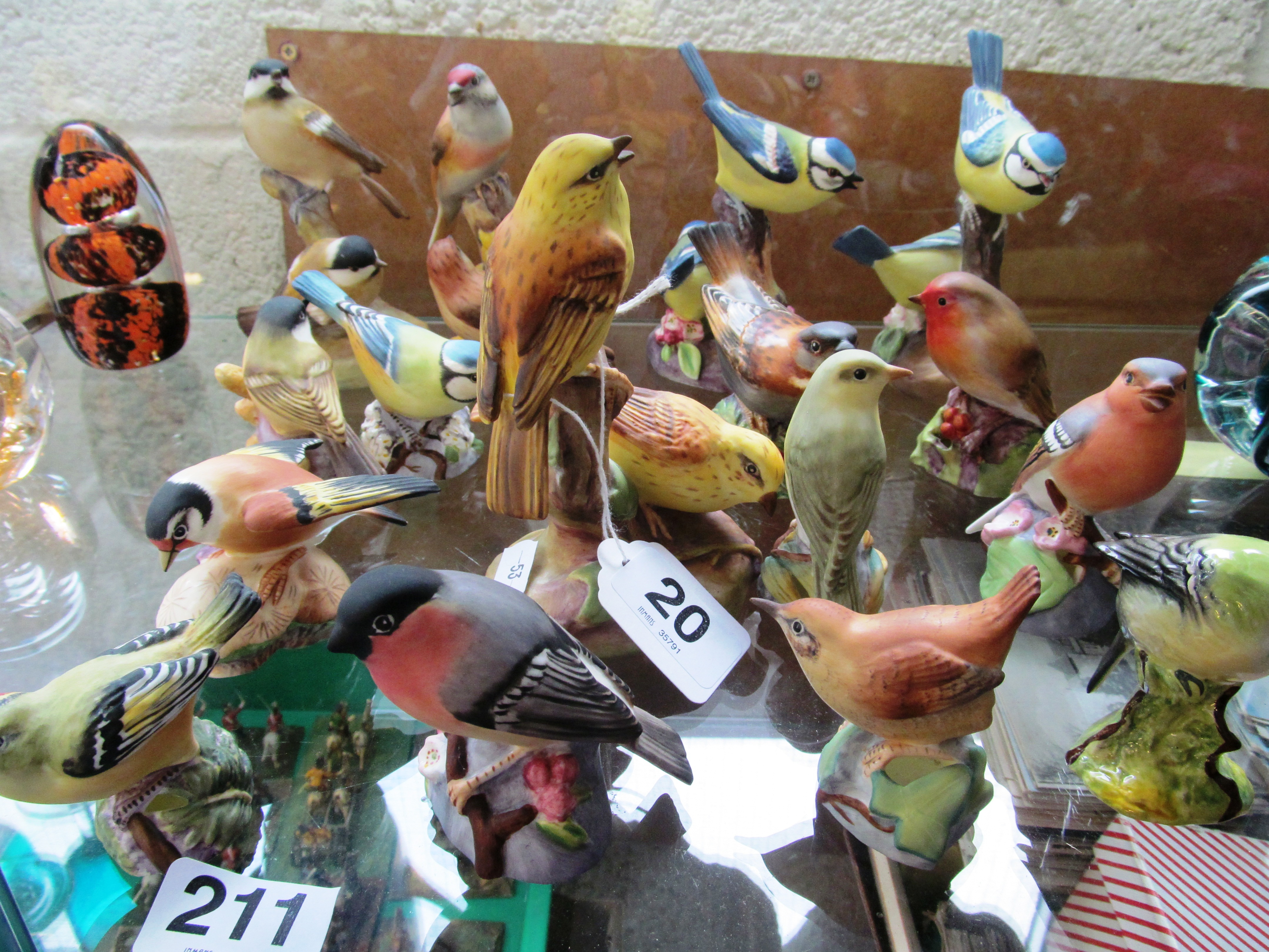 Fifteen Royal Worcester birds and a Beswick bird
