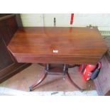 A 19th Century mahogany tea table on four pillar and platform base with splay legs.