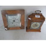 A walnut mantel clock and a barometer