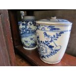 A blue and white oriental vase decorated figures in garden and a large lidded jar decorated bird