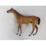 A cold painted bronze horse in the manner of Franz Bergman (back foot bent) inscribed underneath