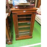 An Edwardian walnut music cabinet.