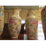 A pair of modern oriental vases pink ground decorated flowers