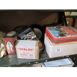 Two circular prints of girls, crystal set and tins and child's brick trolley.