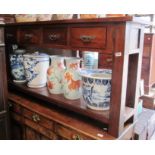 A long oriental style sideboard of four drawers with undertier