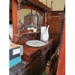 An Edwardian walnut mirror back sideboard with display tier, three frieze drawers and three