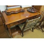 A 19th Century mahogany desk with gallery and two drawers.