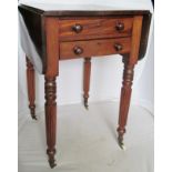 A 19th Century mahogany dropleaf work table on fluted supports