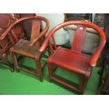 A red coloured oriental shaped back chair and another similar