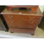 A George III oak chest of drawers.