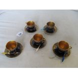 Five Royal Worcester blue and gilt cups and saucers (one a/f) and five enamel coffee spoons