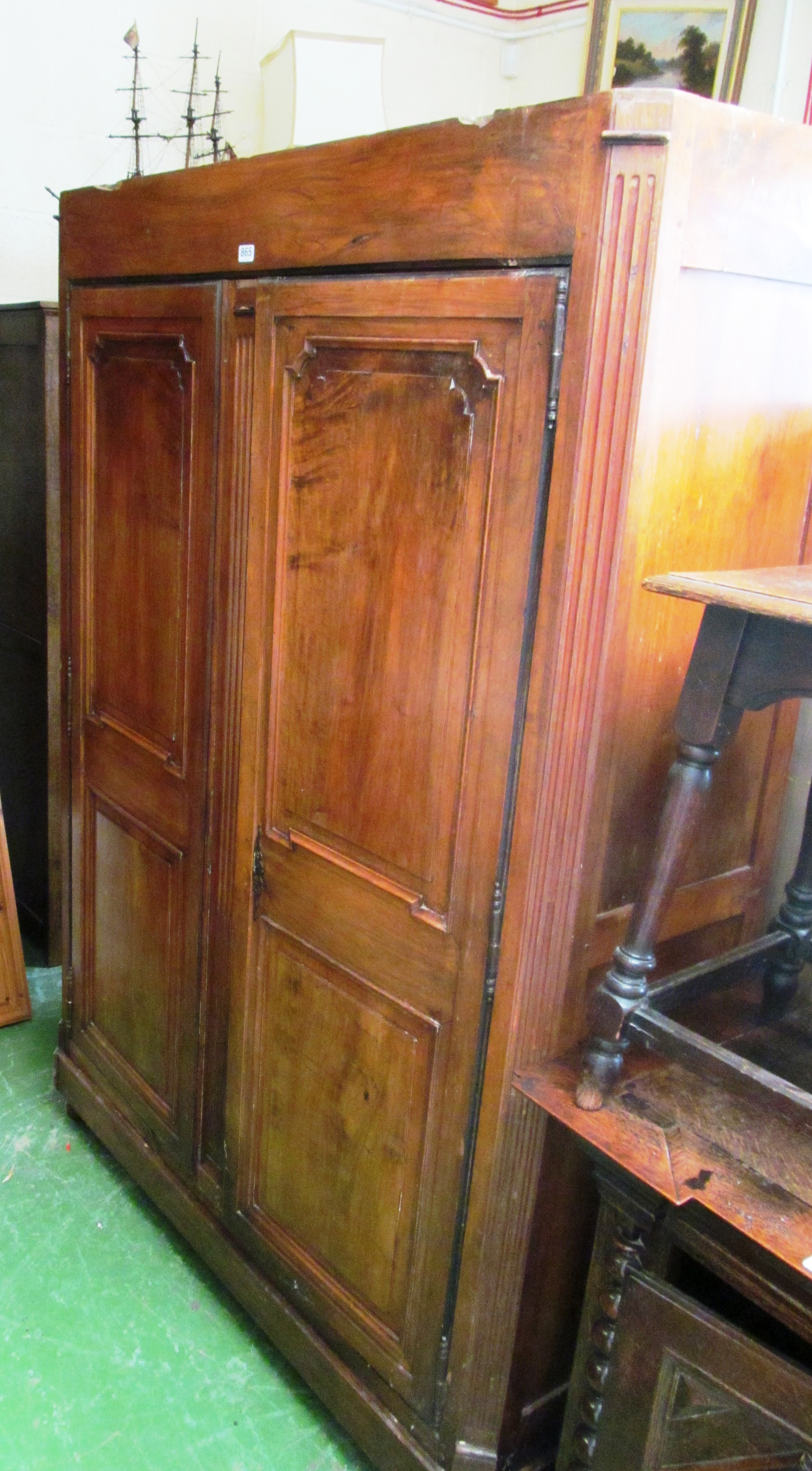 A continental armoire with shelves to sides.