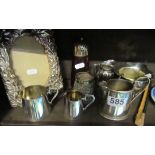 A plated photo frame, cranberry glass sifter and plated jugs