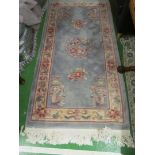 A Chinese blue floral rug