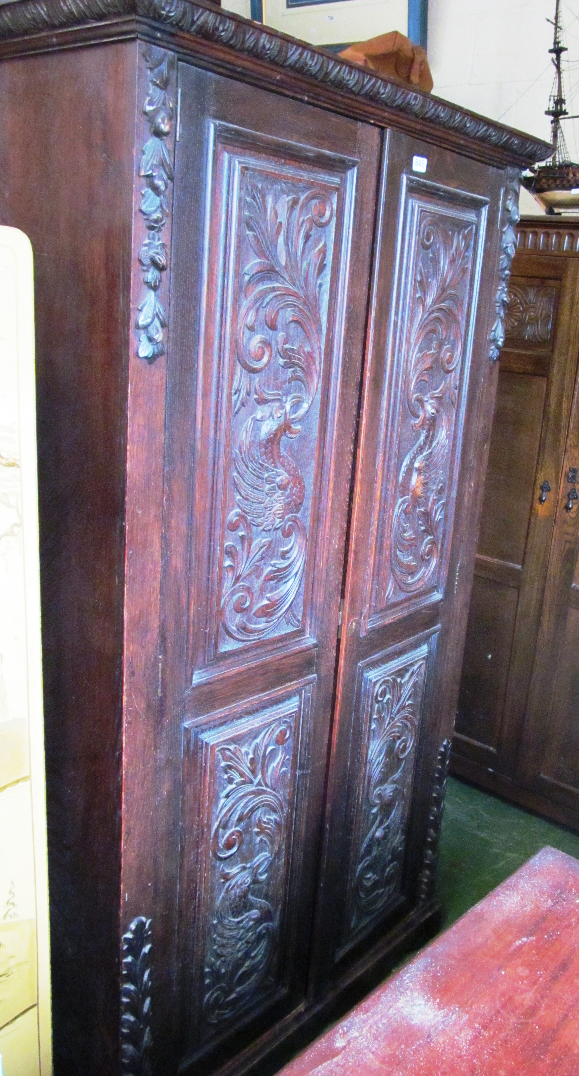 A carved oak wardrobe