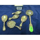 Five silver caddy spoons and a sifter spoon