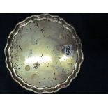 A silver salver shaped border on four shaped feet 16ozs