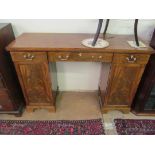 An early 19th Century narrow twin pedestal sideboard three frieze drawers and two cupboards