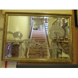 A gilt mirror with scene horse and carriage