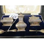 A cased set three silver condiments