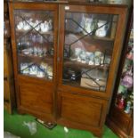 A late 19th Century mahogany display cabinet, two astragal glazed doors opening to reveal six