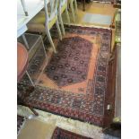 A silk pile rug and another rug