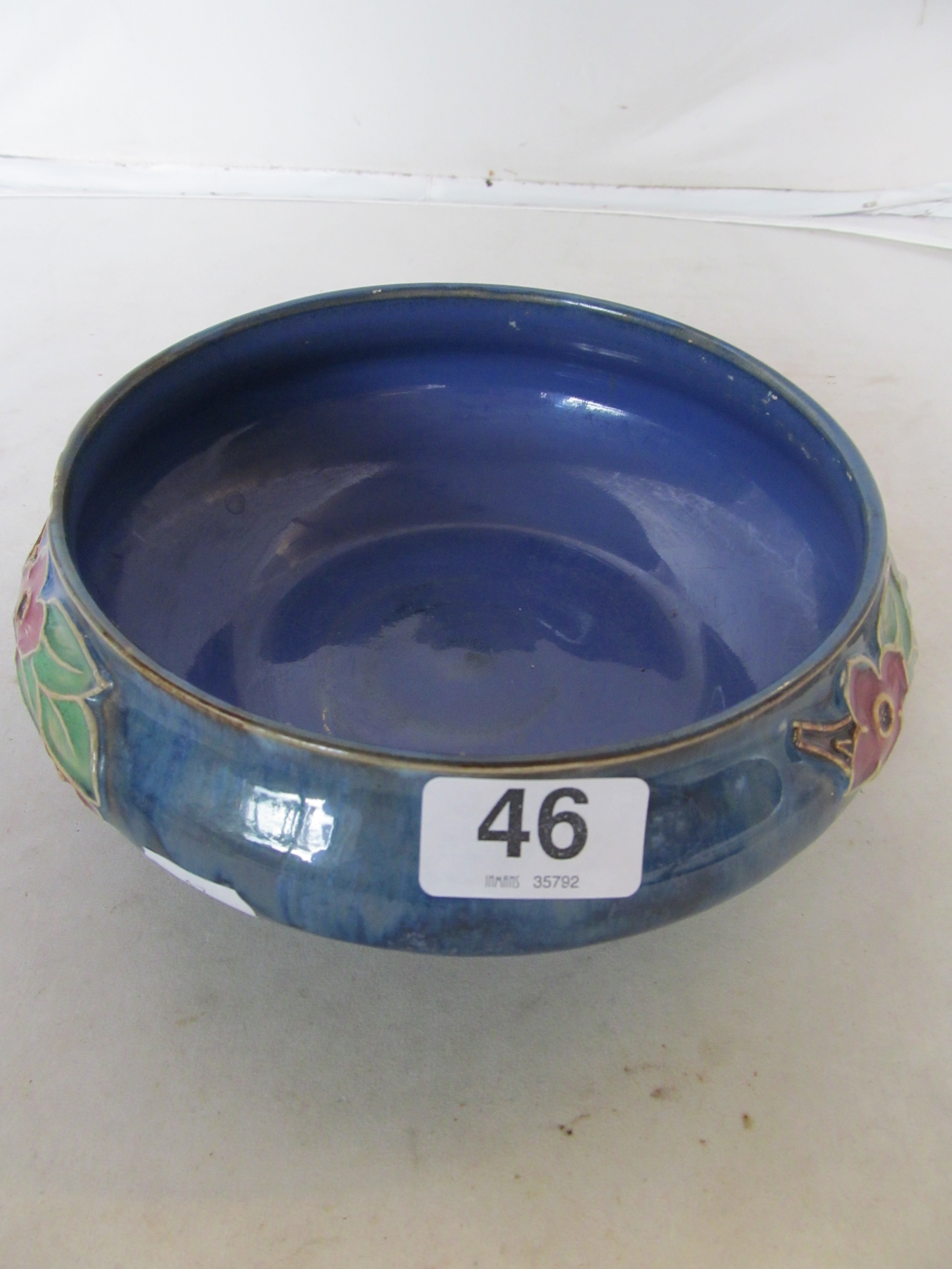 A Royal Doulton blue ground floral bowl