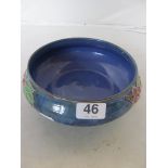 A Royal Doulton blue ground floral bowl