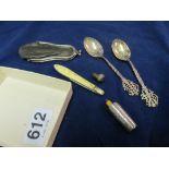 A silver fruit knife, fruit knife, two spoons, wick and acorn