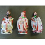 Three oriental figures