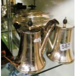 A plated teapot gadrooned body and two coffee pots