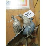 Three metal game birds