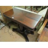 A Victorian mahogany invalid table with adjustable height and two adjustable flaps