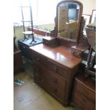 A 19th Century mahogany dressing chest of two short and two long drawers with mirror above