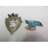 An enamel brooch of a bird and a Victorian shield shaped brooch
