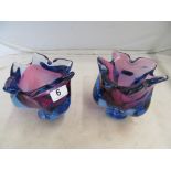 A pair of red/blue glass small vases.