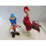 A red glass cockrell and a glass clown