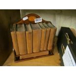 A miniature inlaid book rack and books Reference Library published Houghton & Gunn