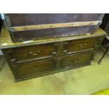 A two drawer antique oak panelled chest